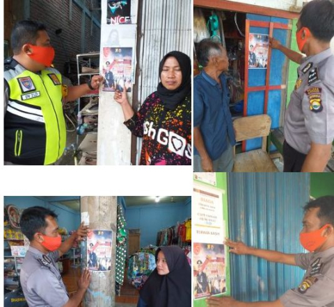 Petugas menempelkan imbauan di tempat keramaian